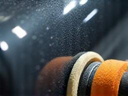 Polishing machine working on car paint.